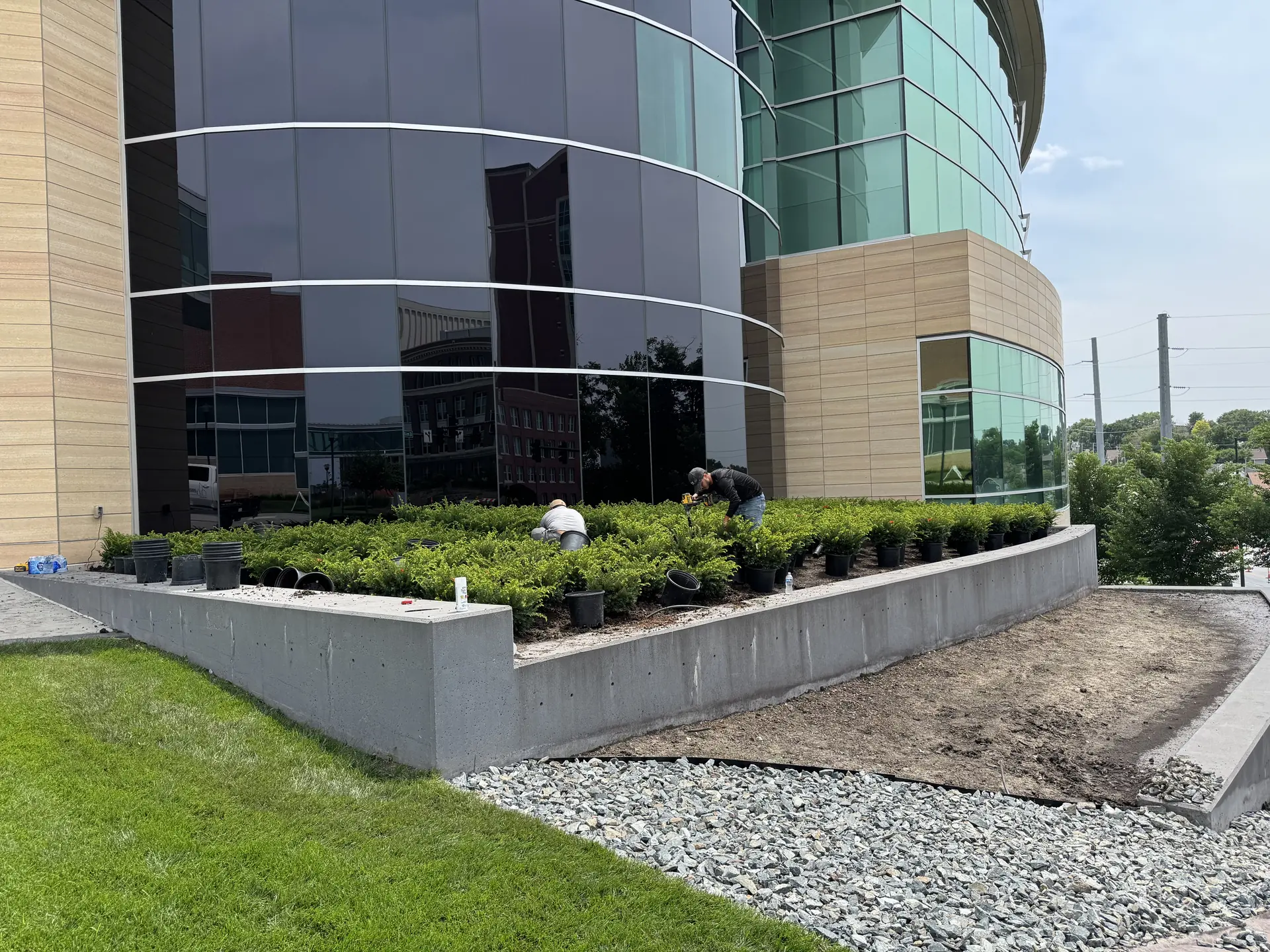 Freshly installed landscape beds, plantings, and hardscape at a completed Landwerks project.