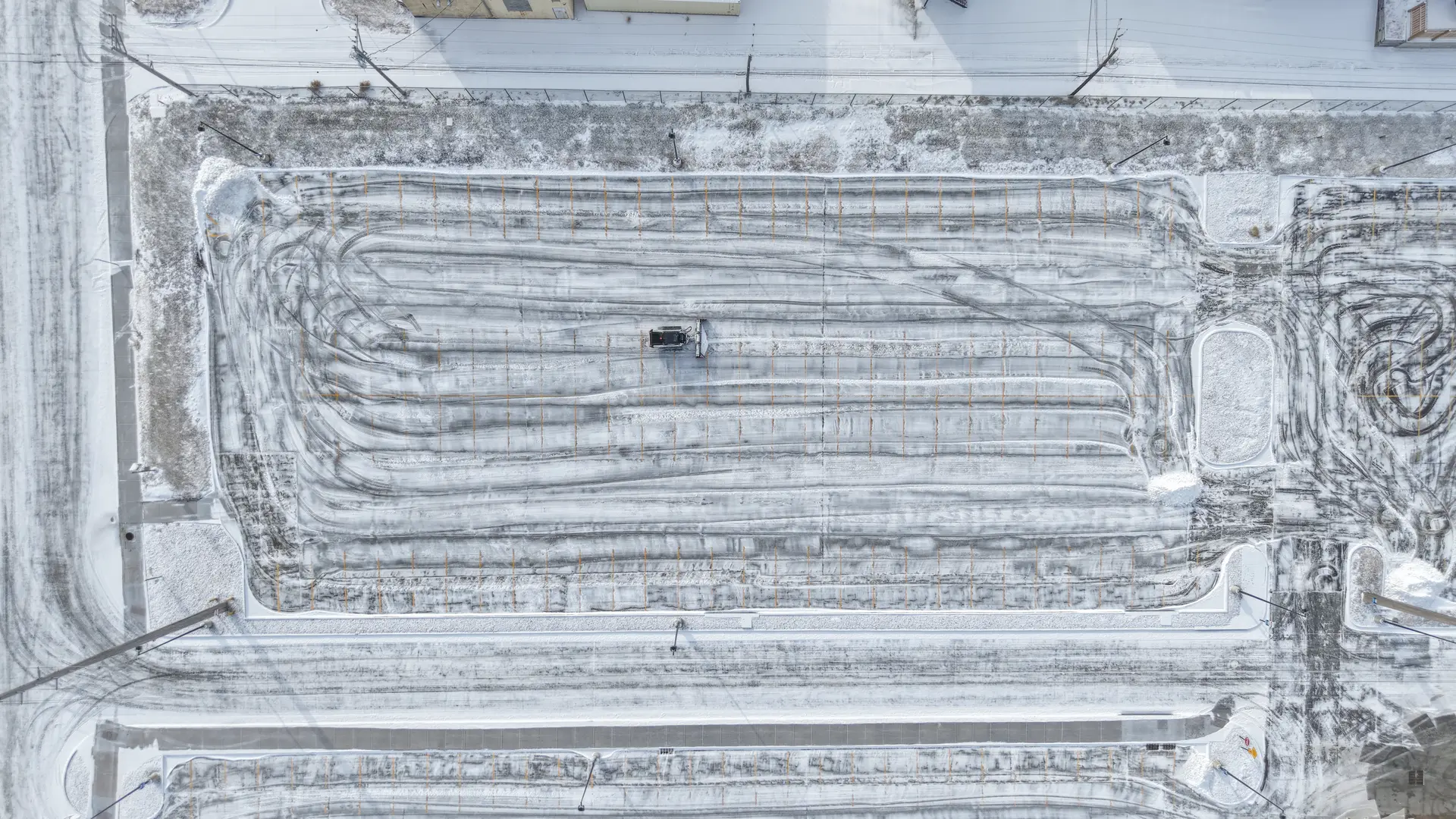 Commercial parking lot cleared of snow and ice by Landwerks equipment